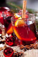 Image showing hot tasty spicy mulled red wine with orange and cinnamon christmas 