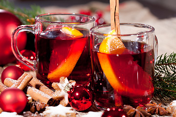 Image showing hot tasty spicy mulled red wine with orange and cinnamon christmas 