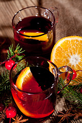 Image showing hot tasty spicy mulled red wine with orange and cinnamon christmas 