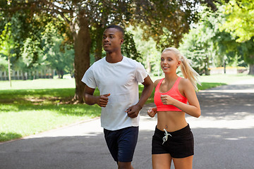 Image showing young couple runner jogger in park outdoor summer