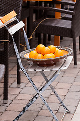 Image showing fresh orange fruits decorative on table in summer