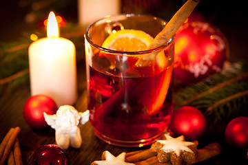 Image showing hot tasty spicy mulled red wine with orange and cinnamon christmas 