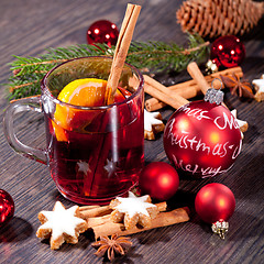 Image showing hot tasty spicy mulled red wine with orange and cinnamon christmas 