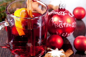 Image showing hot tasty spicy mulled red wine with orange and cinnamon christmas 