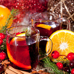 Image showing hot tasty spicy mulled red wine with orange and cinnamon christmas 