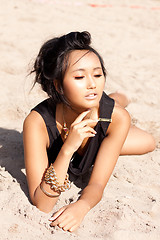 Image showing beautiful asian woman with colorful makeup on the beach 