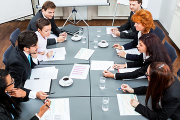 Image showing business team on table in office conference