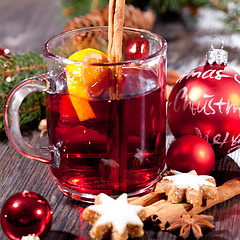 Image showing hot tasty spicy mulled red wine with orange and cinnamon christmas 