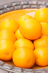 Image showing fresh orange fruits decorative on table in summer