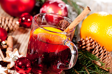 Image showing hot tasty spicy mulled red wine with orange and cinnamon christmas 