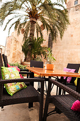 Image showing table flower decoration in cafe restaurant outdoor in summer