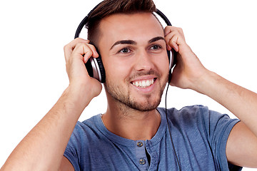 Image showing young attractive man listening to music isolated portrait