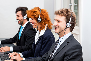 Image showing smiling callcenter agent with headset support