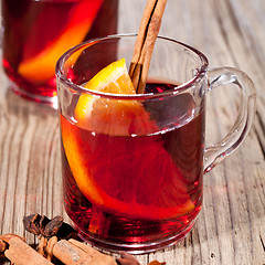 Image showing hot tasty spicy mulled red wine with orange and cinnamon christmas 