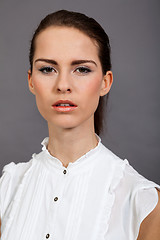 Image showing young attractive brunette woman in studio portrait