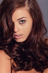 Image showing young attractive bunette woman with glossy shiny hair