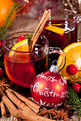 Image showing hot tasty spicy mulled red wine with orange and cinnamon christmas 