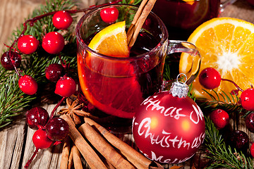 Image showing hot tasty spicy mulled red wine with orange and cinnamon christmas 