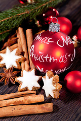 Image showing fresh tasty christmas cinnamon cookies and sticks decoration 