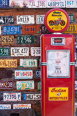 Image showing Old license plates and gas pump