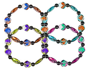 Image showing Bracelets made of plastic and glass on a white background. Colla