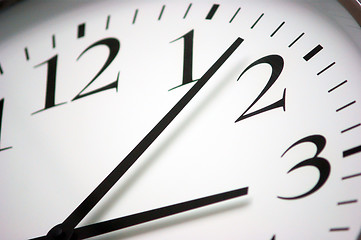 Image showing Closeup of round black and white clock