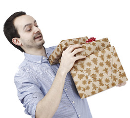 Image showing Young man holding a present