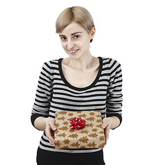 Image showing Young woman holding a present