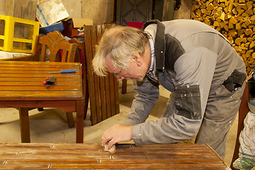 Image showing Man using sandpaper