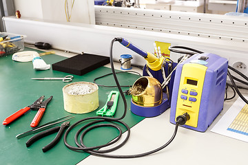 Image showing electronics equipment assembly workplace