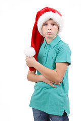 Image showing bored teenager wit red santa hat