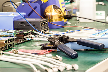 Image showing electronics equipment assembly workplace