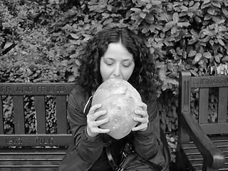 Image showing Girl eating bread