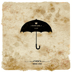 Image showing Vintage postcard. Retro umbrella on grunge background