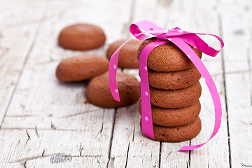 Image showing stack of chocolate cookies tied with pink ribbon