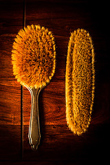 Image showing Hairbrushes on wood