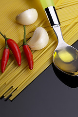 Image showing pasta garlic extra virgin olive oil and red chili pepper