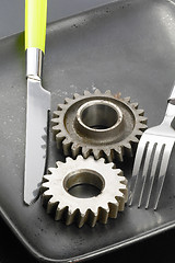 Image showing gearwheels on a plate