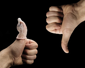 Image showing condom thumbs up and down