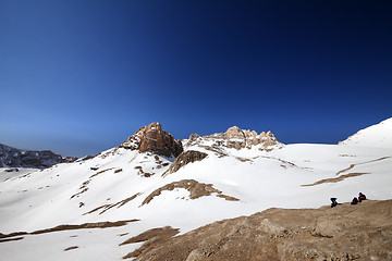 Image showing Two hikers on halt in snowy mountain