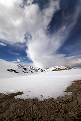 Image showing Snowy mountains and sky with clouds