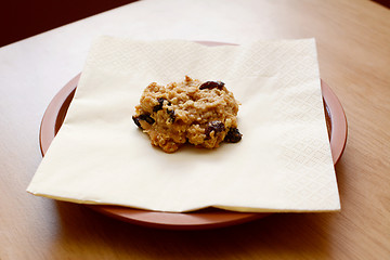 Image showing Freshly baked oatmeal raisin cookie