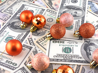 Image showing Dollars notes on christmas balls on it