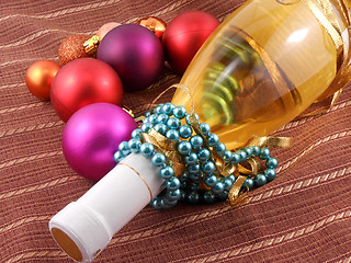Image showing Champagne bottle with Christmas balls and diamonds