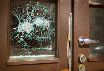 Image showing Broken window on  door by vandalism