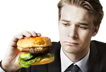 Image showing Businessman eating at work