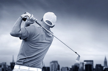 Image showing golfer shooting a golf ball 