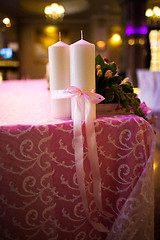 Image showing candles tied with a pink ribbon