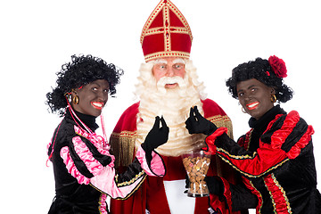 Image showing Zwarte Piet giving pepernoten (cookies) to Sinterklaas