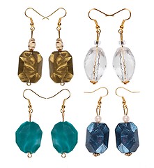 Image showing Earrings made of plastic and glass on a white background. Four p